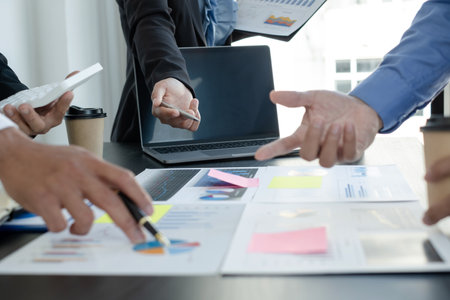 Meeting business team leaders about charts, financial graphs showing results are analyzing and calculating planning strategies, business success building processes.の写真素材