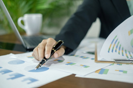 Businesswomen or accountants working on financial investment, calculating, analyzing, and marketing...