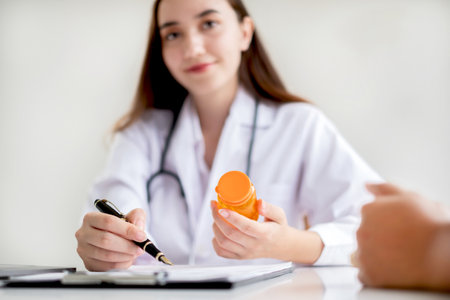 Female doctors who treat patients make an appointment to listen to the results after a physical examination and explain medical information and diagnose the disease. Medical concepts and good health.の写真素材