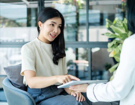 Female CEO and businesswoman meeting to discuss business plan displayed on screen laptop analyze and calculate planning strategies. business success process.の写真素材