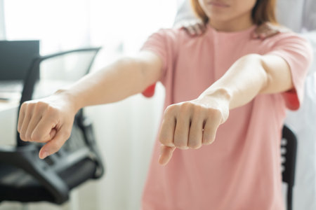Female physiotherapists provide physical assistance to patients with shoulder injuries massaging their shoulders for muscle recovery in the rehabilitation center. Physiotherapy concepts.の写真素材