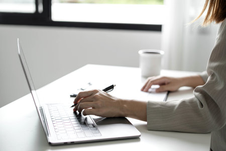 Business woman employer holding resume hiring recruit looking cv resume to hire candidates, analyzing information before job interview. Recruitment concepts.の写真素材