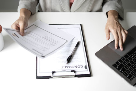 Business woman employer holding resume hiring recruit looking cv resume to hire candidates,...