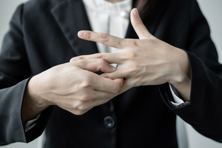 Woman hand with wrist pain numbness and pain in the palm of the hand has pain and tingling in the nerve endings This is a side effect of sitting and working for a long time on a laptop at the office.の写真素材