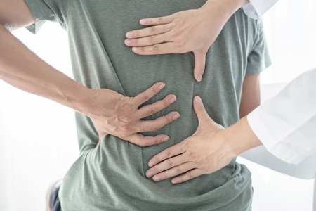 Male patients consulted physiotherapists with Low back pain for examination and treatment. Rehabilitation physiotherapy concept	.の写真素材