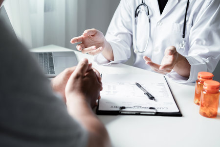 Female doctors who treat patients make an appointment to listen to the results after a physical examination and explain medical information and diagnose the disease. Medical concepts and good health.の写真素材