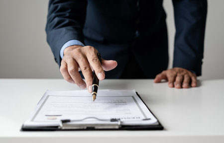 Business man employer holding resume hiring recruit looking cv resume to hire candidates, analyzing information before job interview. Recruitment concepts.の写真素材