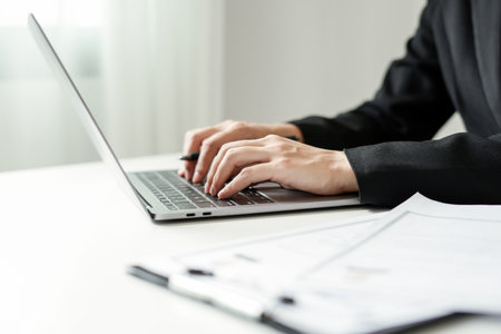 Business woman employer holding resume hiring recruit looking cv resume to hire candidates, analyzing information before job interview. Recruitment concepts.の写真素材