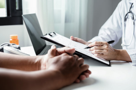 Female doctors who treat patients make an appointment to listen to the results after a physical examination and explain medical information and diagnose the disease. Medical concepts and good health.の写真素材