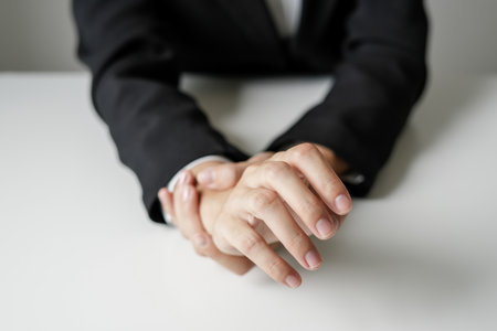 Woman hand with wrist pain numbness and pain in the palm of the hand has pain and tingling in the nerve endings This is a side effect of sitting and working for a long time on a laptop at the office.の写真素材