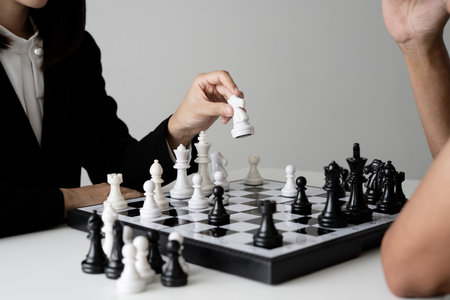 hand Two business moving chess in competition shows leadership, followers and business success strategies. concepts Business strategy and leadership.の写真素材