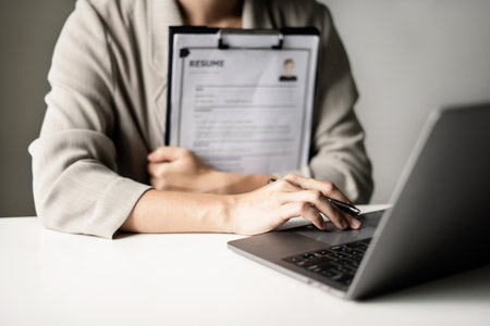 Business woman employer holding resume hiring recruit looking cv resume to hire candidates,...