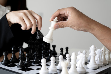 hand Two business moving chess in competition shows leadership, followers and business success...