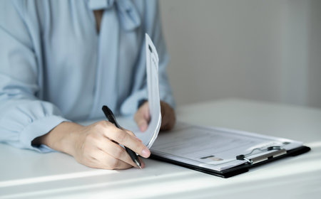 Business woman employer holding resume hiring recruit looking cv resume to hire candidates,...