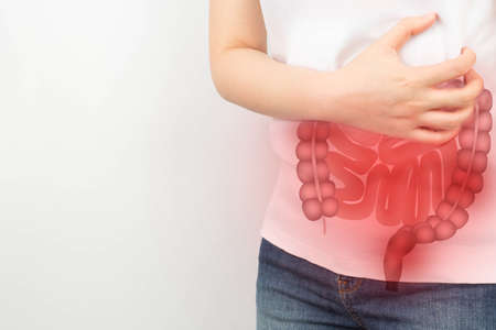 Woman suffering from abdominal pain with small and large intestines organ shape. Digestive tract...