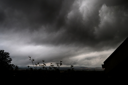 gray rain clouds. Dark stormy sky backgroundの写真素材