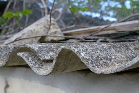 Asbestos roof. Dangerous asbestos dust in the environment. Health problemsの写真素材