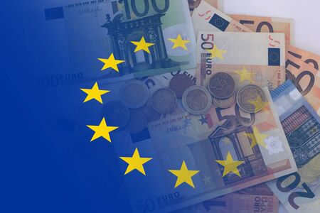 Flag of Europe with euro notes and coins as a background