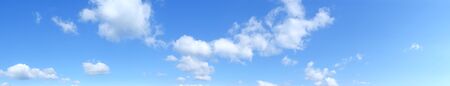 Blue panoramic sky with cumulus of white clouds, HDの写真素材