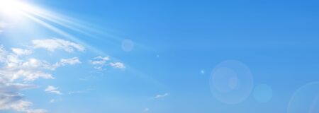 blue sky with white clouds and sunの写真素材