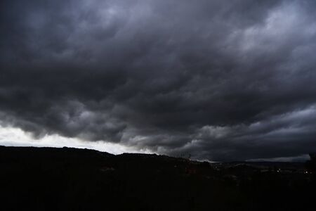 Thunderstorm with heavy rains flying over the dark prairie, time frameの写真素材