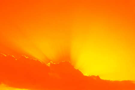 The sun breaking through white clouds.の写真素材