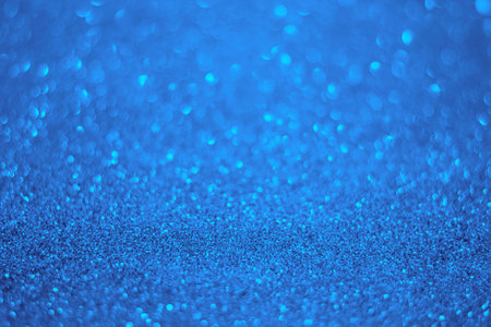 Light blue glitter background. Texture of light blue glitter particles.の写真素材