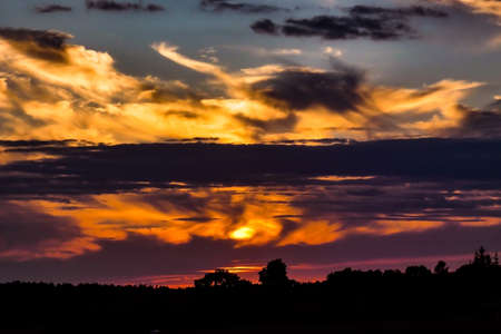 Summer evening with sunsetの写真素材