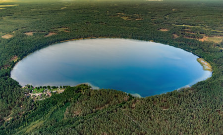 Aerial view of a lake in the forests of Lithuania, wild nature. The name of the lake is "Lavysas", Varena district, Europe.の写真素材