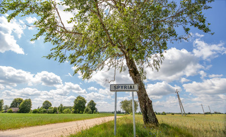 Road sign - the beginning of the settlement "Spyriai", village Varena district, Lithuaniaの写真素材