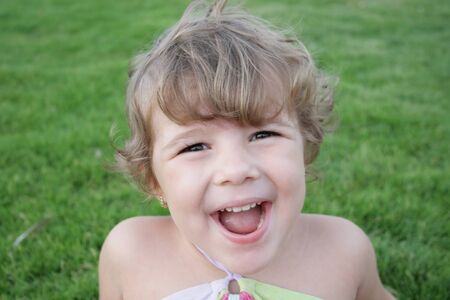 lafhing happy cute small girl portret