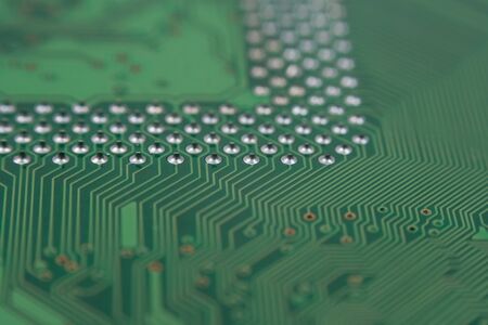 closeup to back of a green computer main board