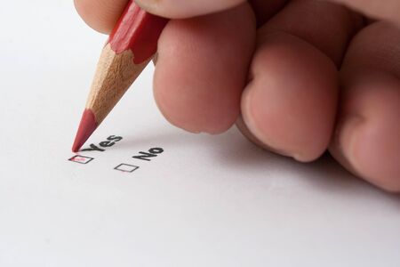 yes or no decition checkbox made with red pencilの写真素材