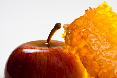 apple and honeycomb closeup on  white backgroundの写真素材