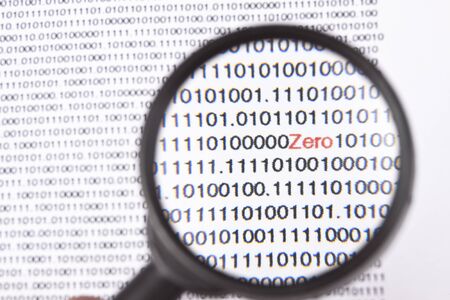 binary code on white background one in red magnifying glassの写真素材