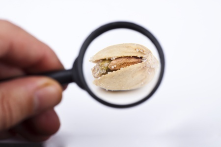 fresh roasted pistatio closeup on white backgroundの写真素材