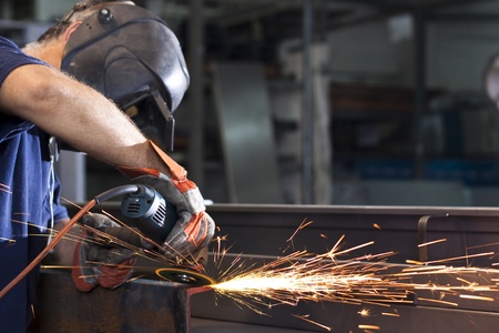 sparks during working with steel in the factory sparks during working with steel in the factory