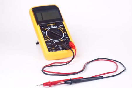 yellow multimeter with black and red probs focus on the probs isolated on whiteの写真素材