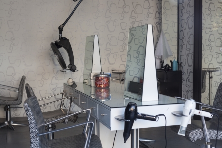 Barber shop salon with seats and mirrorsの写真素材