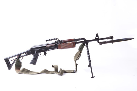 old machine gun with tripod and bayonet isolated on white