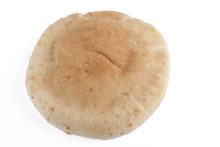 Single israeli flat bread pita isolated on white backgroundの写真素材