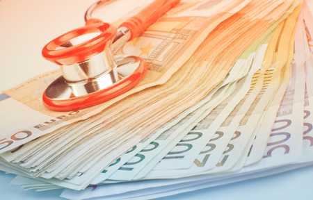 Euro banknote pile with red stethoscope inked style imageの写真素材