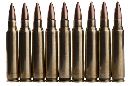 Rifle bullets in a row isolated on white background