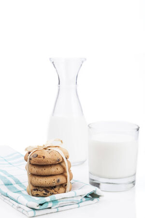 Glass of milk and chocolate chips cookiesの写真素材
