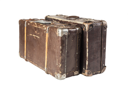 Two Old Brown used and weathered suitcase isolated on white backgroundの写真素材