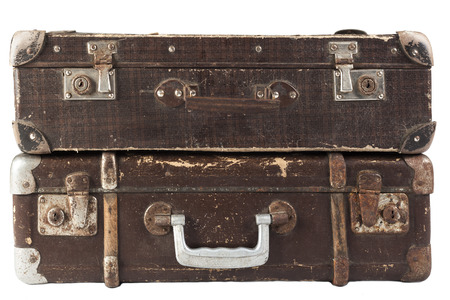 Two Old Brown used and weathered suitcase isolated on white backgroundの写真素材