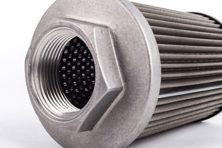 Metal hydraulic oil filter closeup isolated on whiteの写真素材