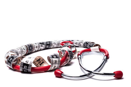 Red Stethoscope With Black Measuring Tape Isolated on Whiteの写真素材