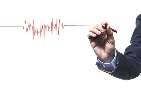 Hand drawing red heart beat with red pencil isolated on white backgroundの写真素材