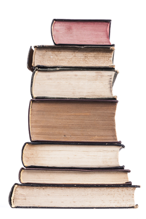 Old books pile isolated on white backgroundの写真素材